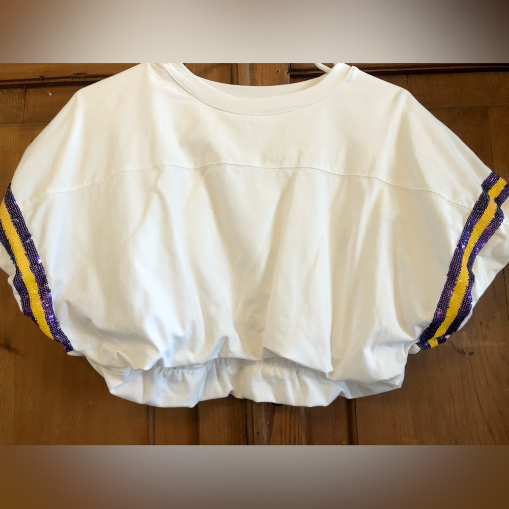 Queen of Sparkles white cropped jersey with purple and gold sequins